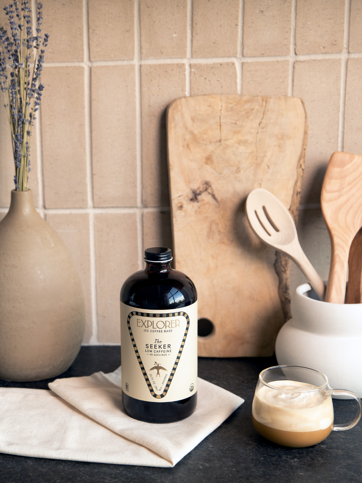 Explorer Cold Brew 32oz cold brew coffee concentrate bottle with black cap and label, ready for brewing and serving.