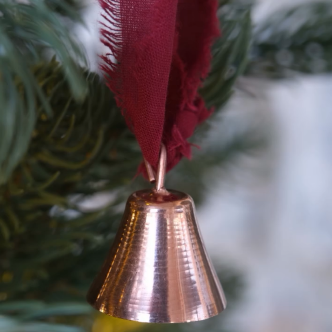 Copper Mantra Bell by Sertodo with intricate design, featuring a clapper inside, used for meditation or spiritual practices.