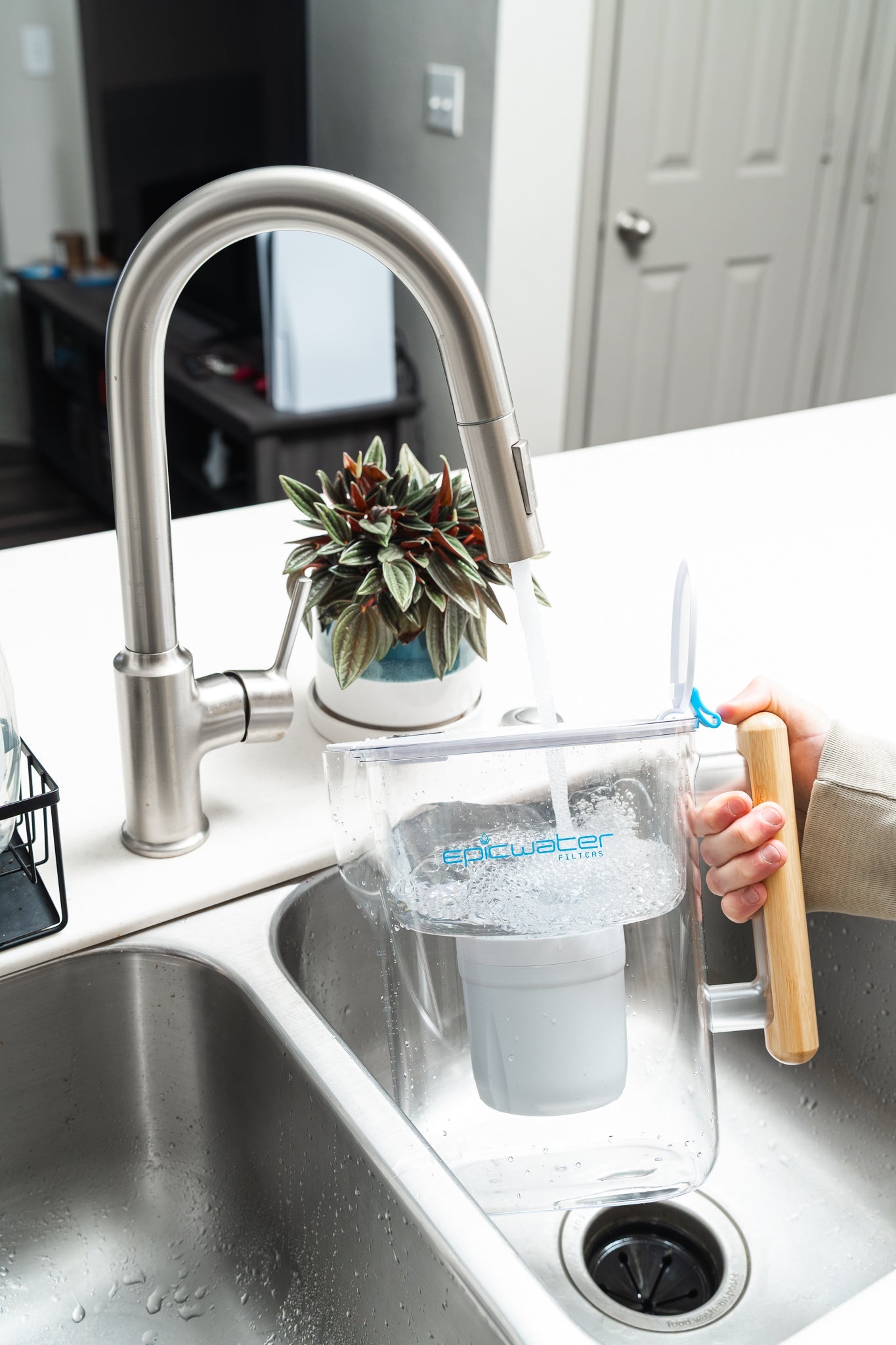 Epic Water Filters Pure XP pitcher with red lid, designed to reduce fluoride, PFAS, and parasites for clean drinking water.