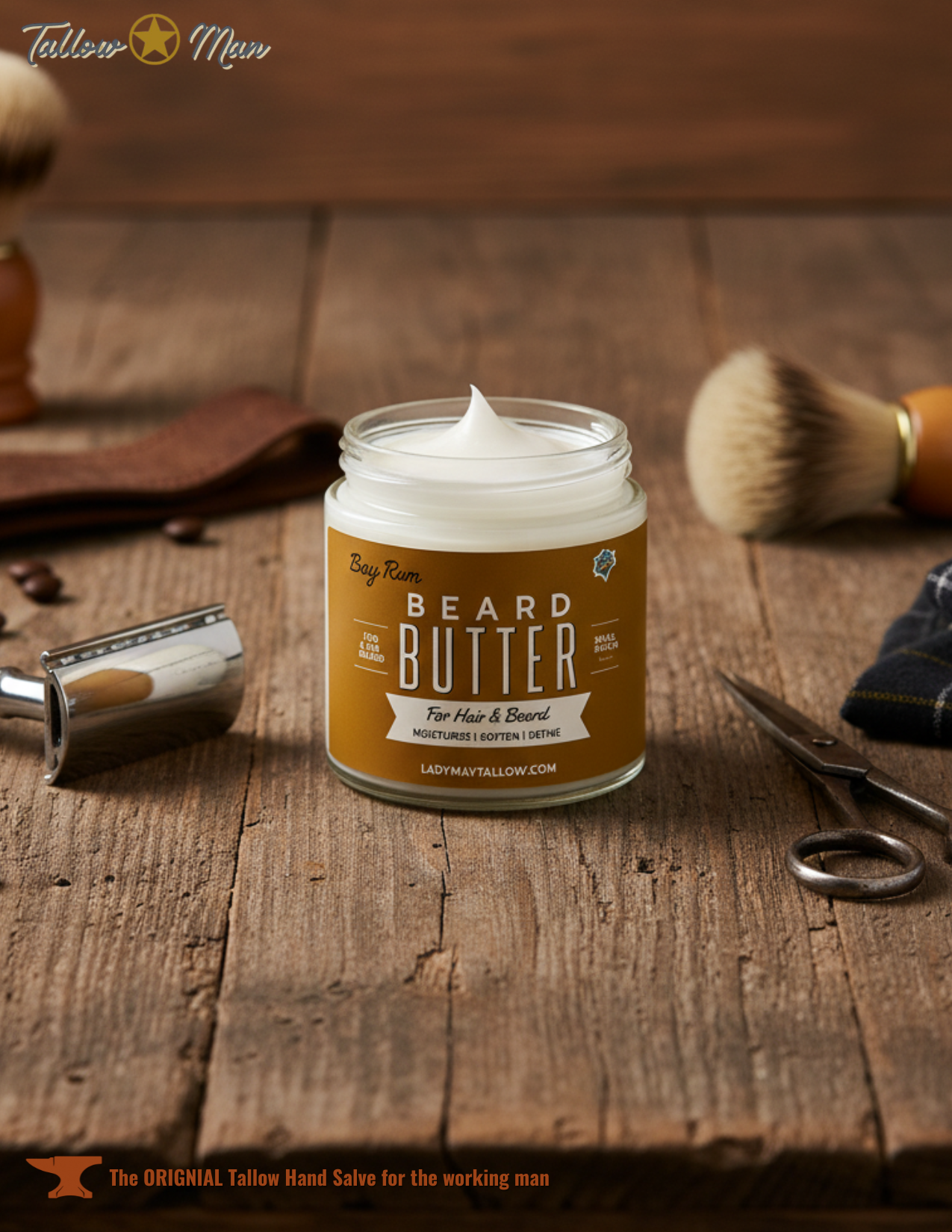 A jar of Lady May Tallow Bay Rum Beard & Body Butter for Men rests on a rustic wooden surface with grooming tools nearby. The label highlights its all-natural tallow formula for nourishing and softening hair, beard, and skin.
