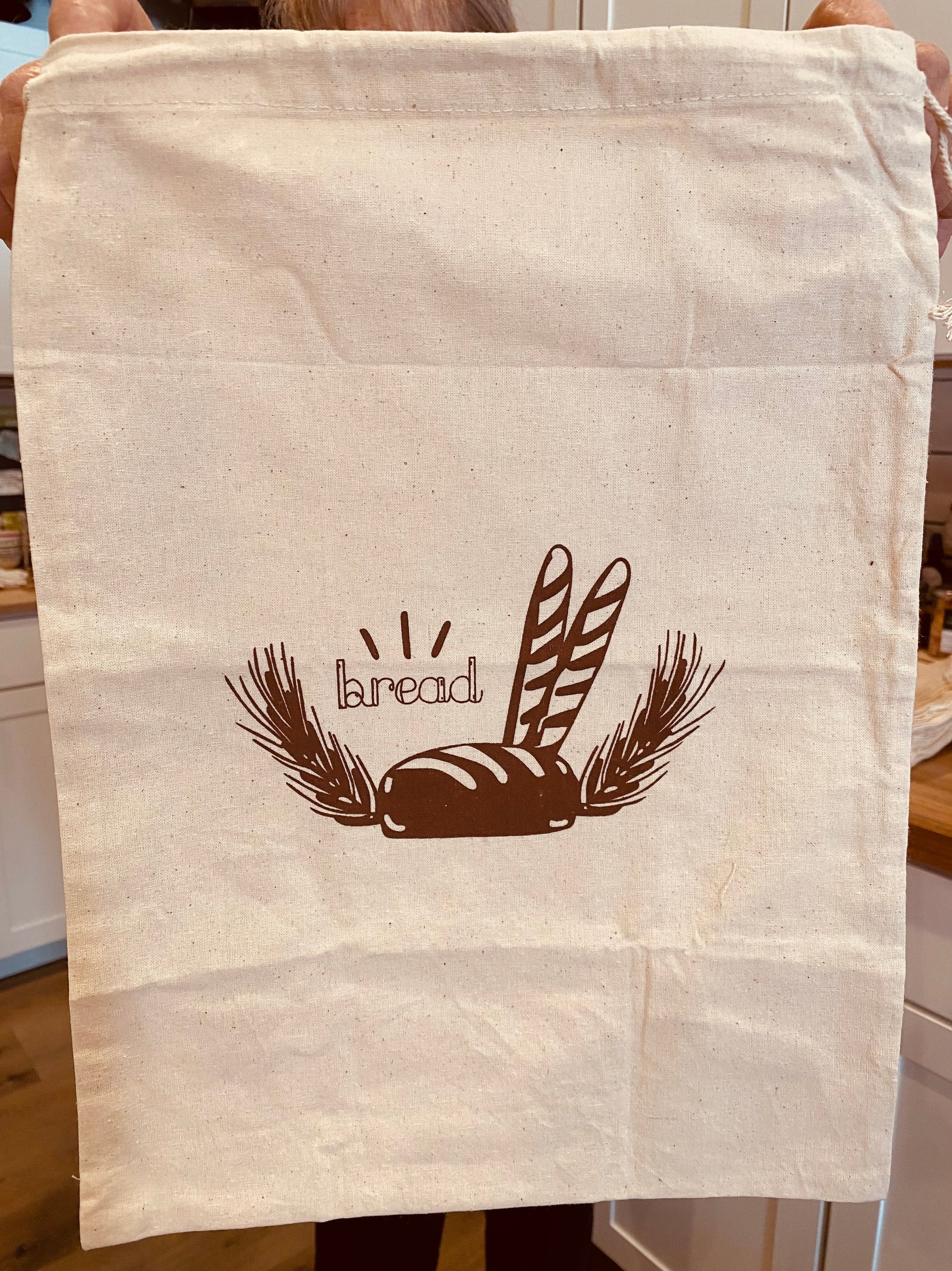 Onic Brands LLC bread bag with the Onic Brands merch logo, made of durable fabric for storing baked goods.