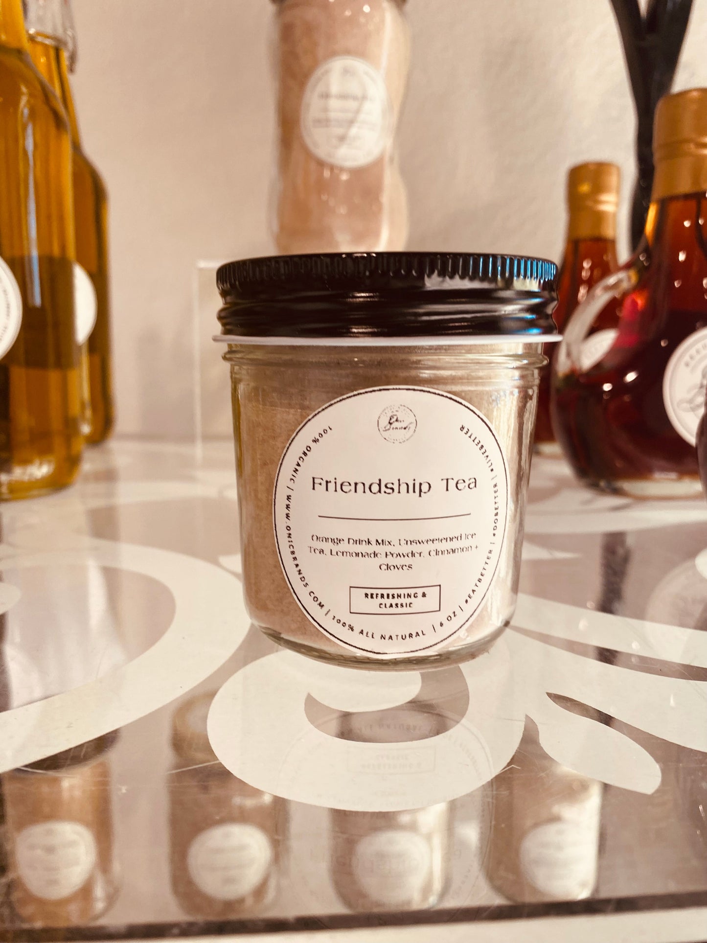 Friendship Tea drink mix by Onic Brands LLC featuring a colorful packet with tea ingredients and brewing instructions.