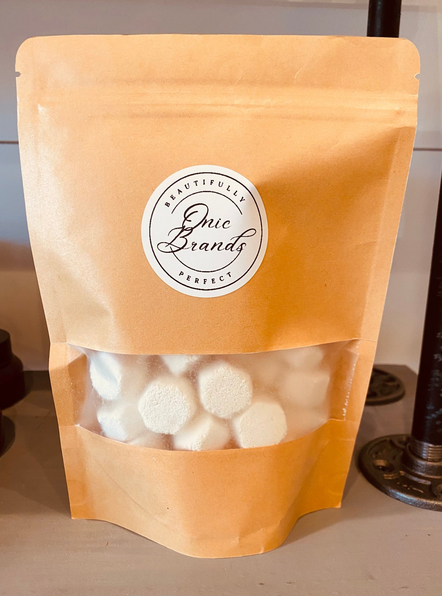 Onic Brands all natural dishwasher tabs in a box with several tabs visible, showcasing eco-friendly cleaning product.