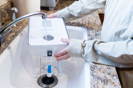 Epic Water Filters Pure XP Dispenser in red, designed to reduce fluoride and PFAS in drinking water, with a sleek modern design.