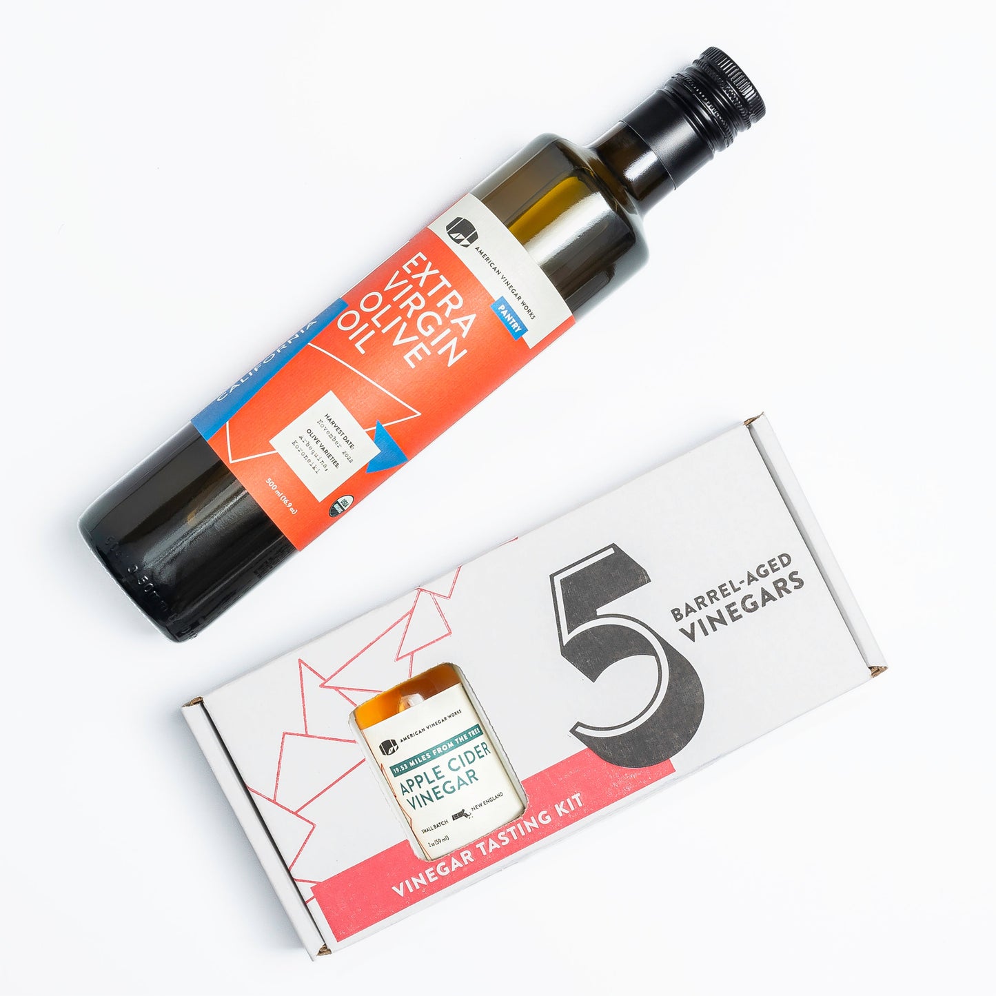 Mini American Vinegar Works oil and vinegar sampler bottle set with assorted vinegar varieties.