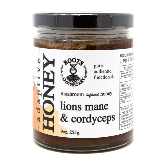 Roots Apothecary adaptive honey with lion’s mane and cordyceps mushrooms jar.