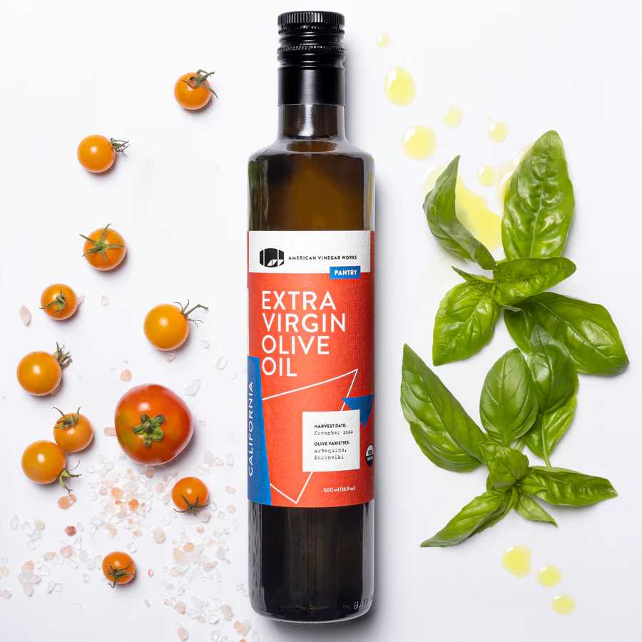 American Vinegar Works extra virgin olive oil bottle, part of the oil and kitchen essential vinegar set, with clear label and dark glass bottle.