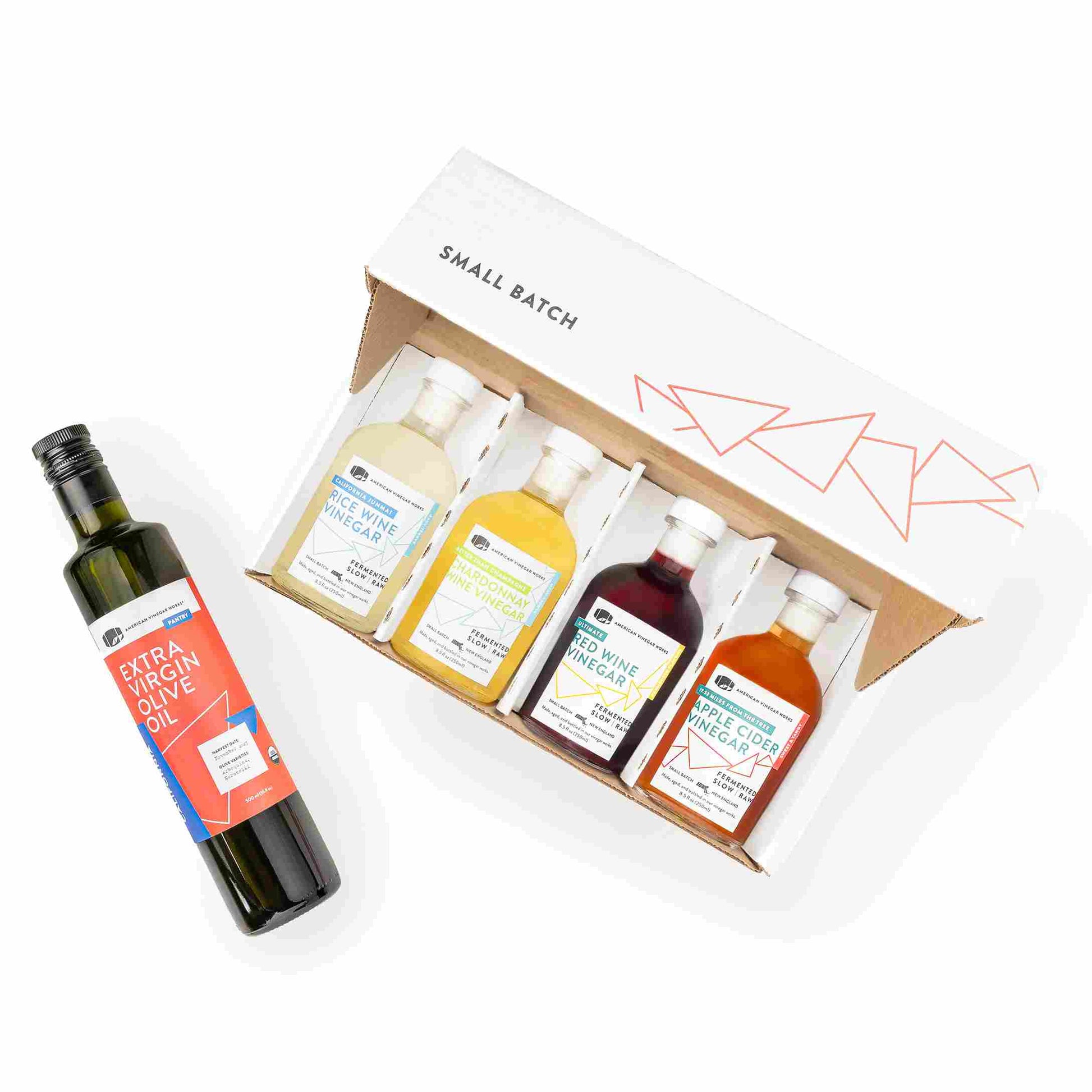 American Vinegar Works small batch gift set featuring assorted kitchen and oil vinegars in elegant glass bottles.