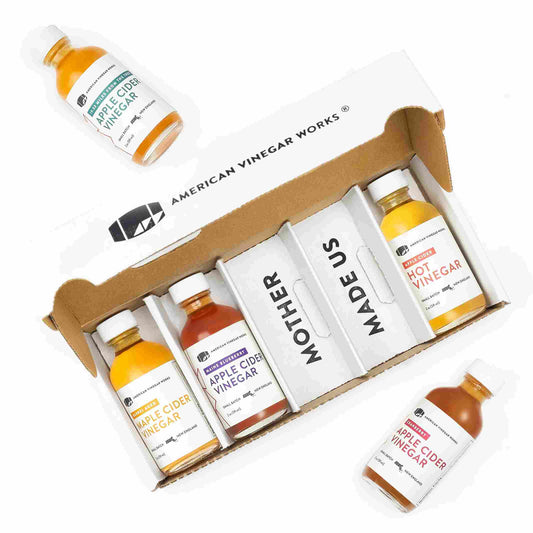 American Vinegar Works apple cider vinegar sampler pack featuring various vinegar bottles in a colorful variety set.