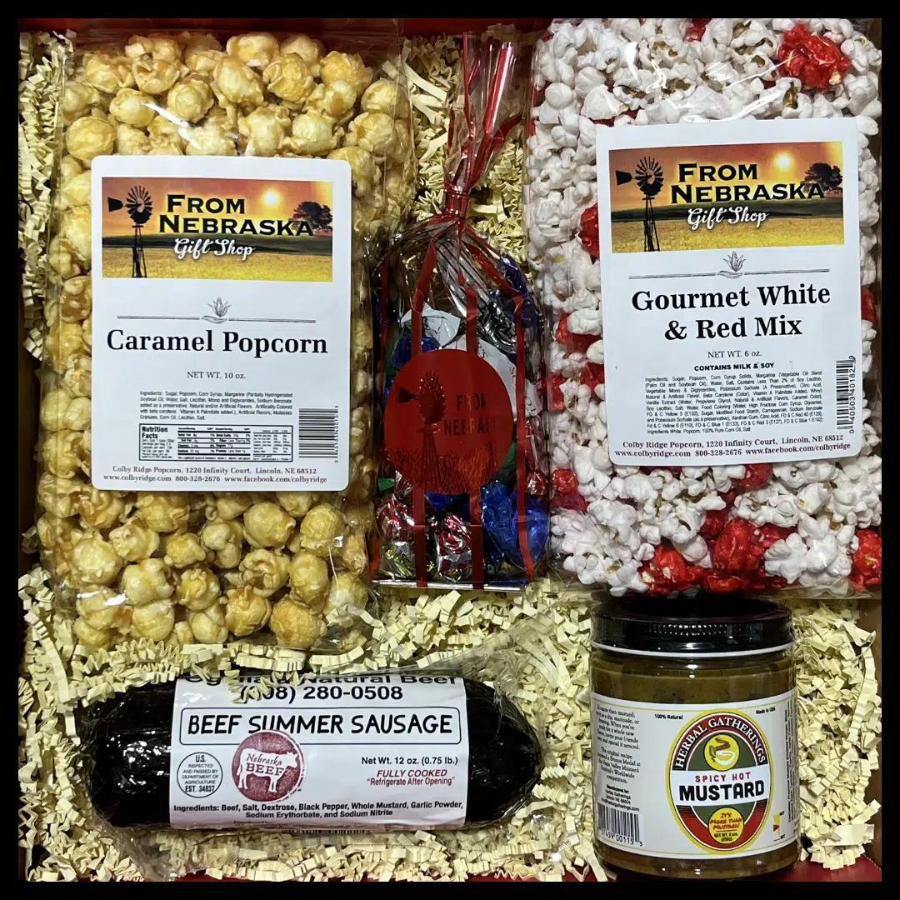 Armchair Snacks and Popcorn Gift Box from BuyNebraska.com featuring assorted snacks and gourmet popcorn in a gift basket.