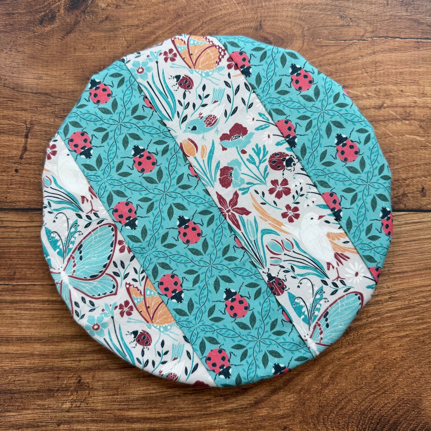 Small bowl and banneton covers from Five Oaks Farm, showcasing woven fabric covers and a ceramic bowl on a rustic surface.