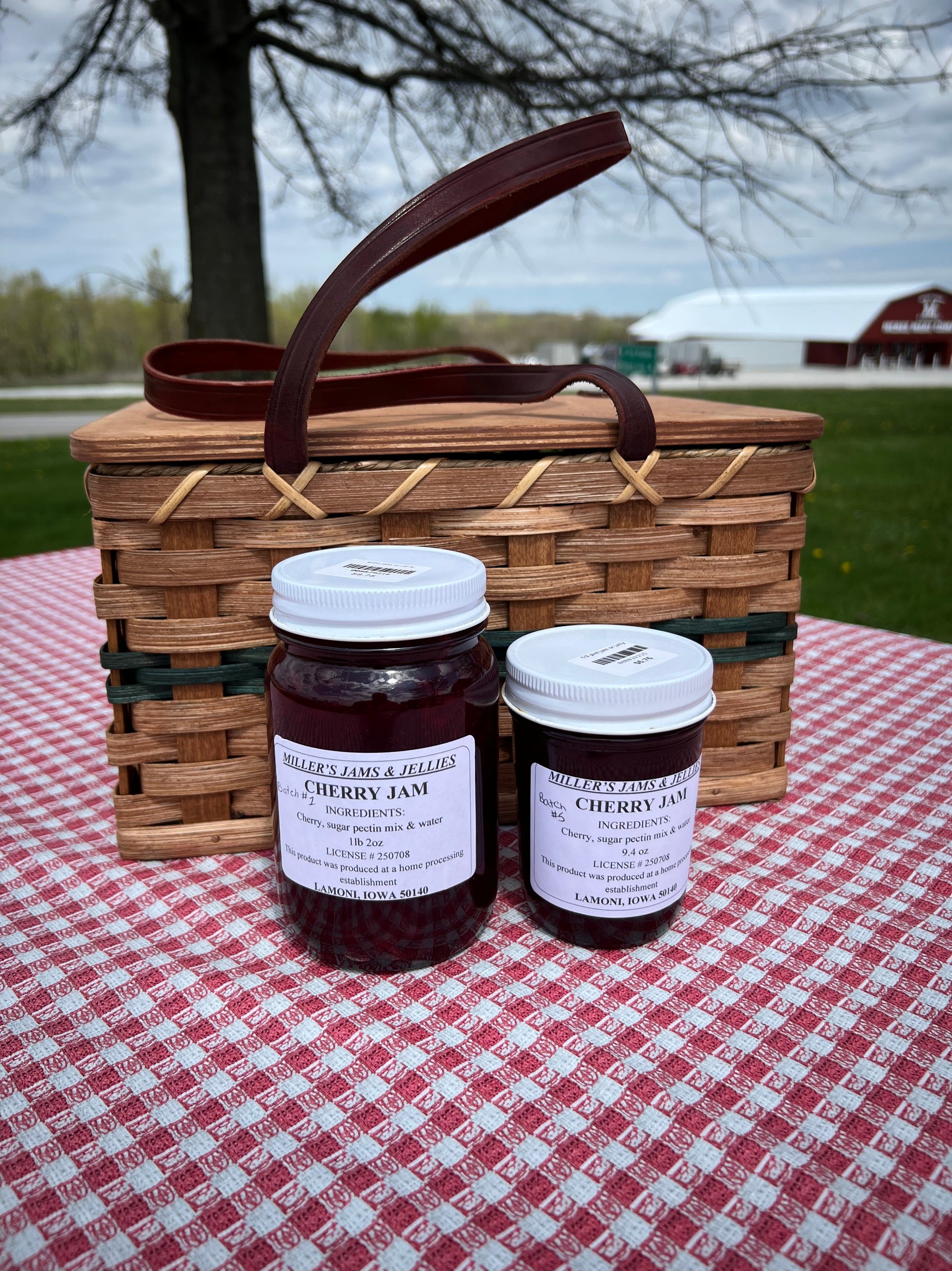 Amish Country Store Miller's Cherry Jam jar showcasing rich, red cherry jam in a glass jar with a label, Amish-made Amish jam.