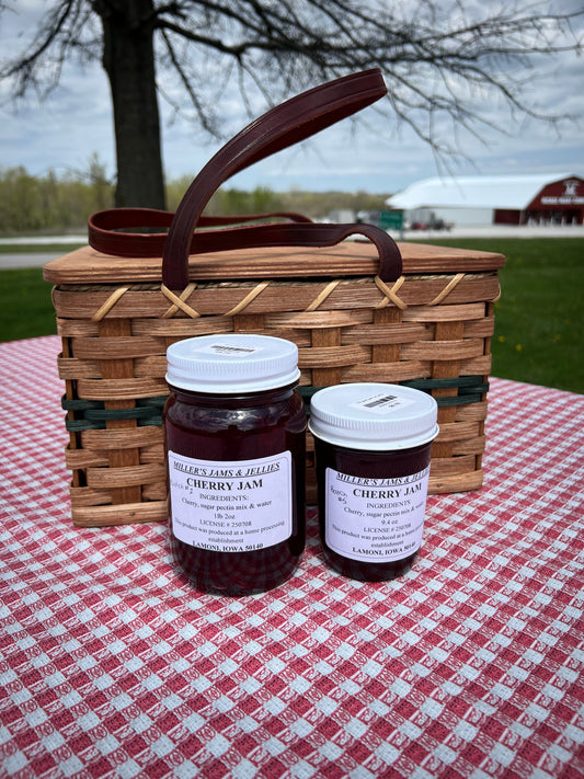 Amish Country Store Miller's Cherry Jam jar showcasing rich, red cherry jam in a glass jar with a label, Amish-made Amish jam.