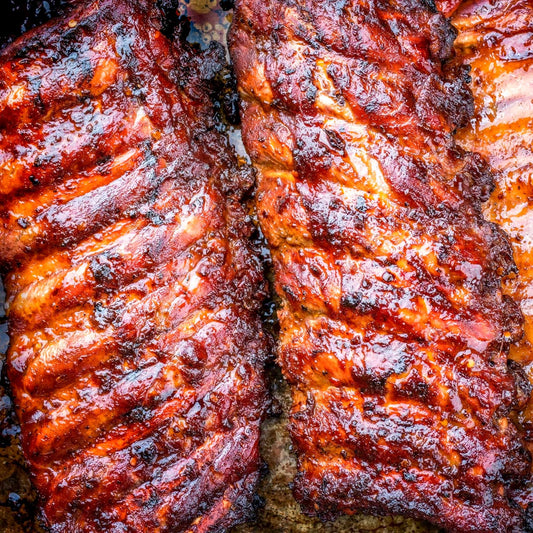 Build-a-Rib Package from Pig of the Month BBQ featuring juicy, tender baby back ribs perfect for BBQ meat lovers.