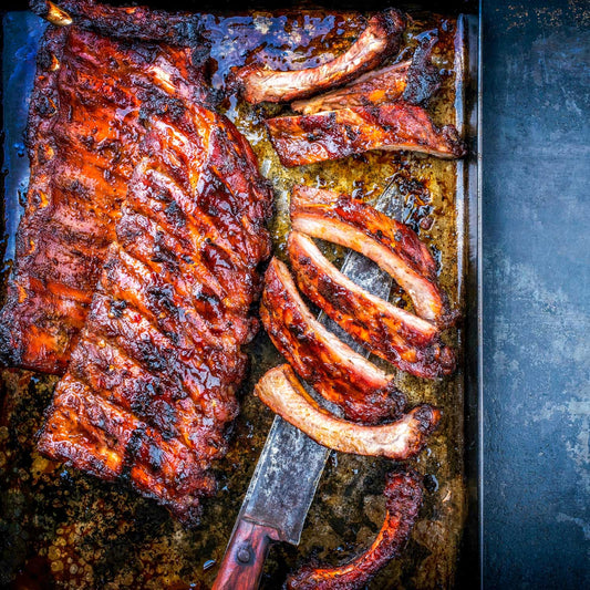 Award-winning Pig of the Month BBQ Build-a-Rib Package featuring juicy, tender baby back ribs ready for nationwide shipping.