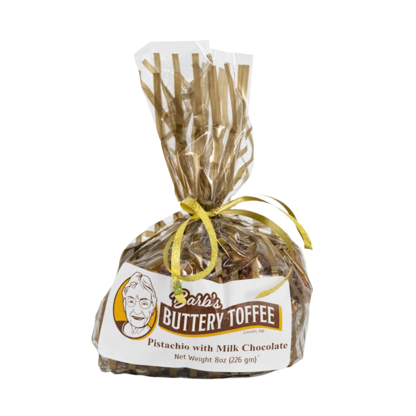 Homemade milk chocolate toffee with pistachios, buttery texture, 8 oz, from Barb's Toffee, featuring a rich, nutty appearance.