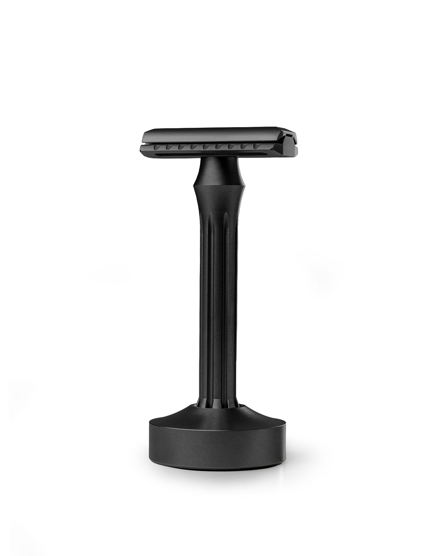 Blackland Razors Blackbird safety razor with a sleek black finish and textured handle, shown with a sturdy stand.