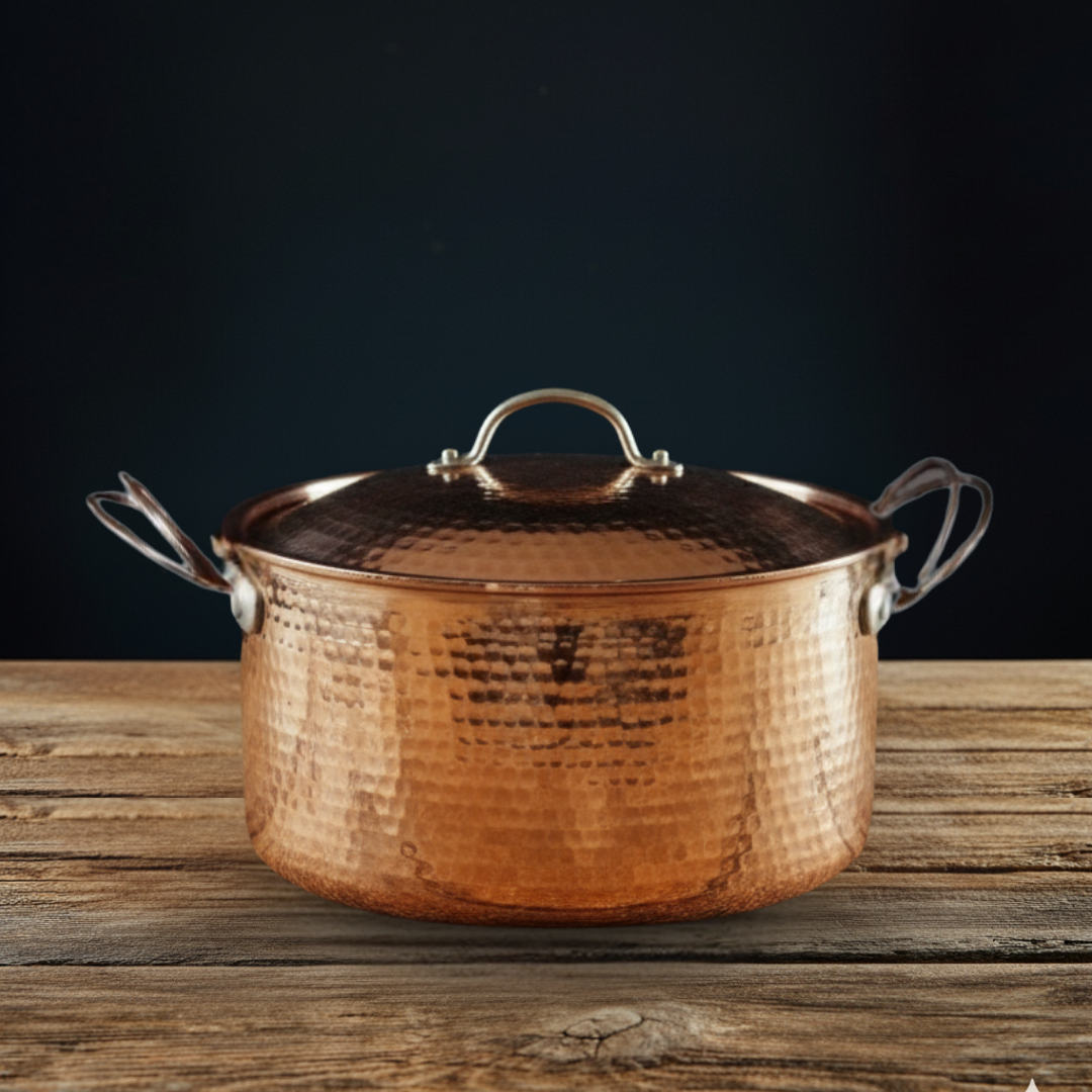 Large copper Dutch oven by Sertodo, showcasing shiny, durable cookware with a polished copper finish for versatile kitchen use.