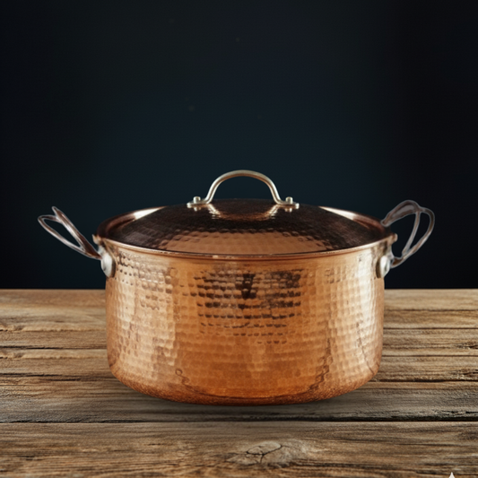 Large copper Dutch oven by Sertodo, showcasing shiny, durable cookware with a polished copper finish for versatile kitchen use.