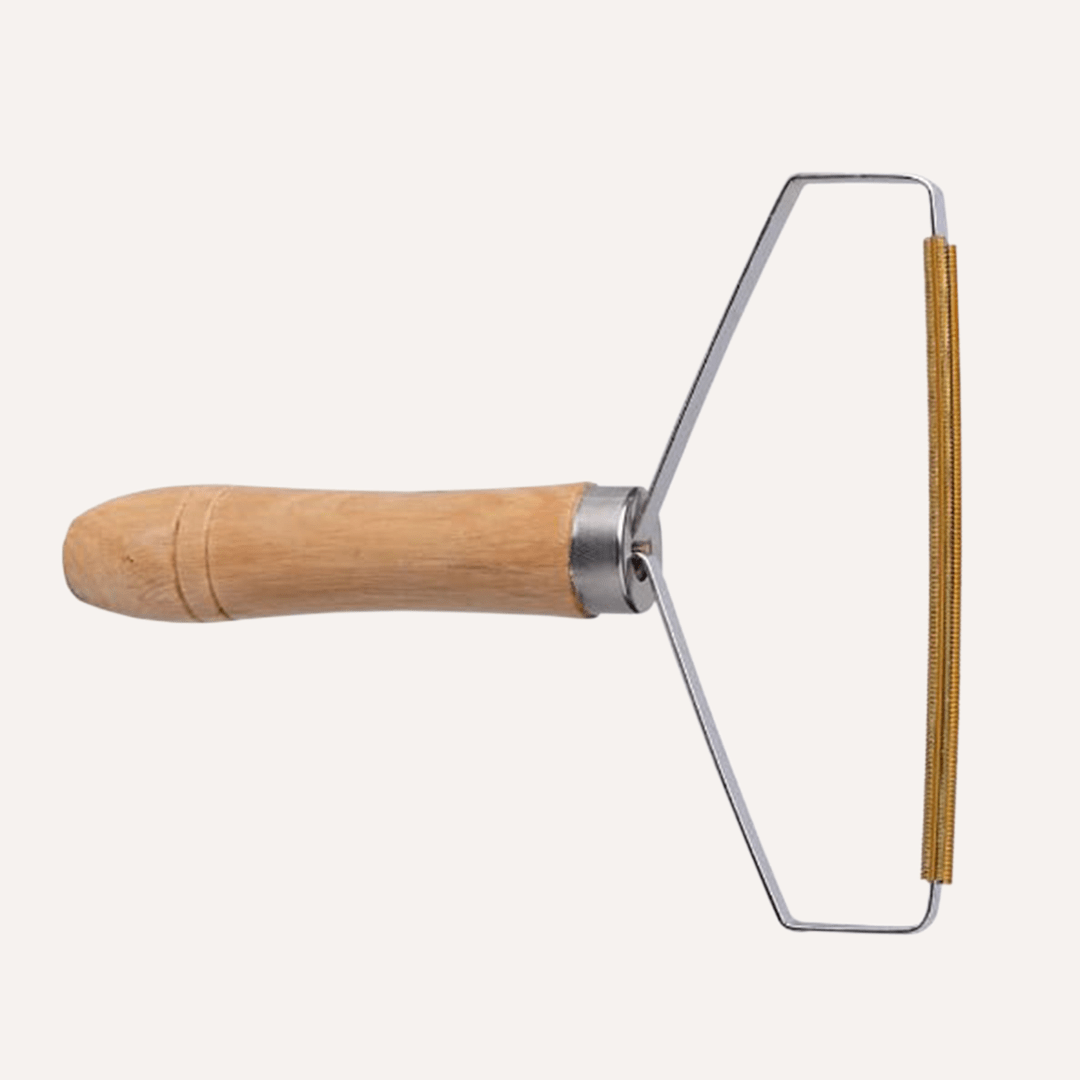Beech wood pet hair lint remover from Tilley + Me, eco-friendly dog grooming tool for removing pet hair from fabrics.