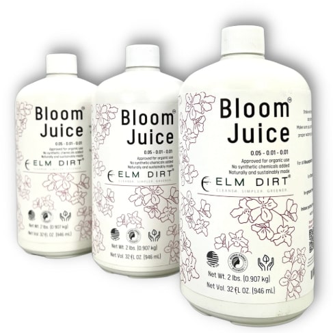 Three white bottles of Elm Dirt Bloom Juice—our award-winning formula for spectacular flowers—each with floral line art and black text labels, are arranged side by side against a white background.