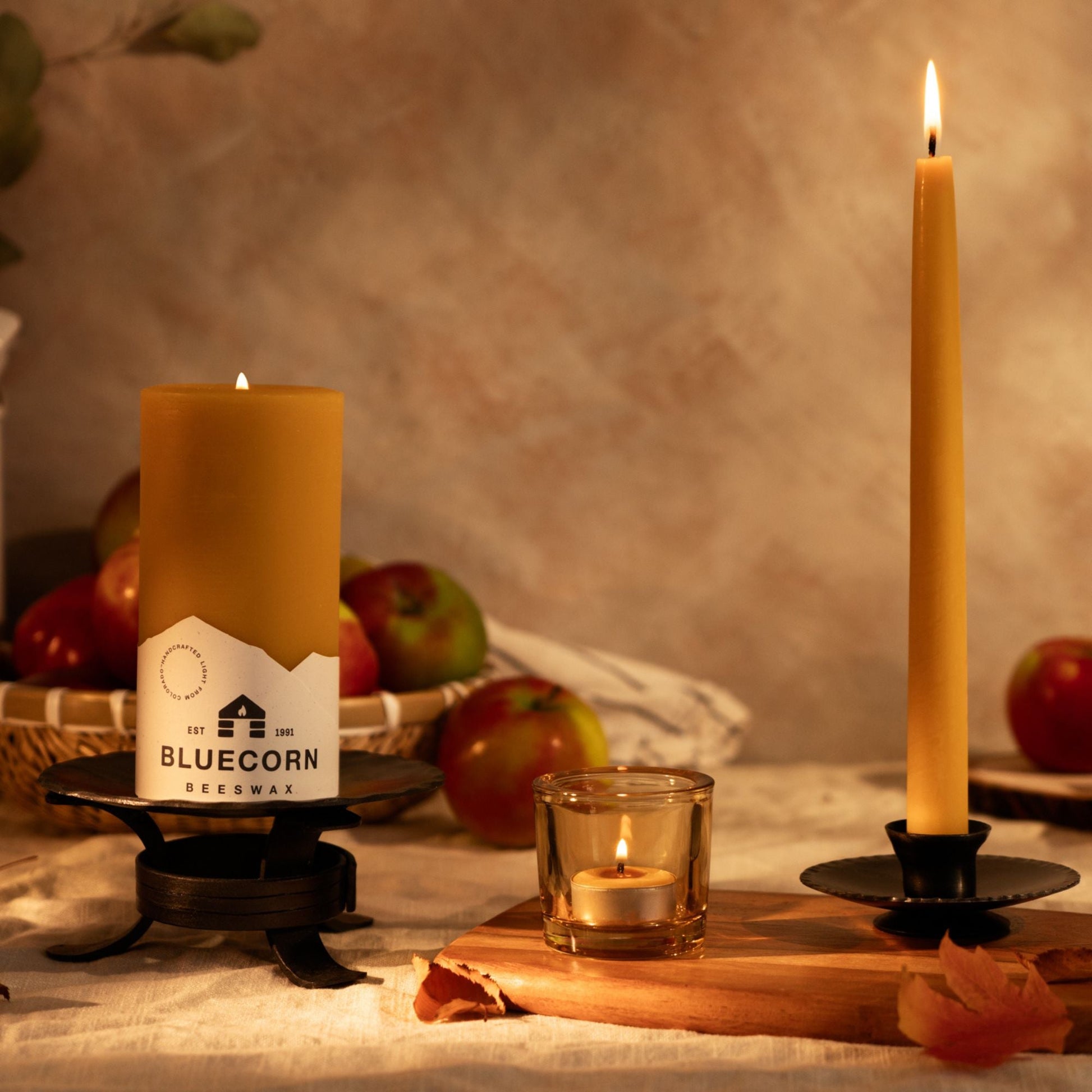 Bluecorn Beeswax Pillar Candles in glass holders, featuring natural raw beeswax for fall decor and warm candlelight ambiance.