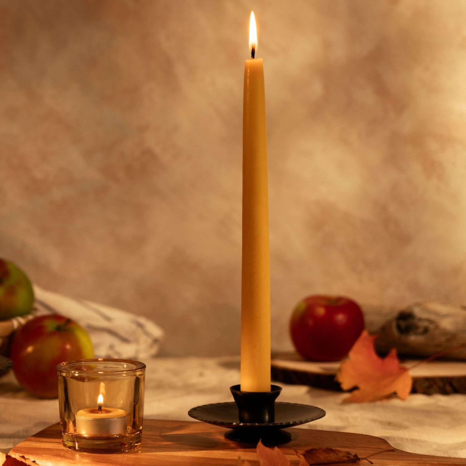 Bluecorn Beeswax Taper Candles in a bundle, with matching tea lights, ideal for fall decor and creating warm ambient lighting.