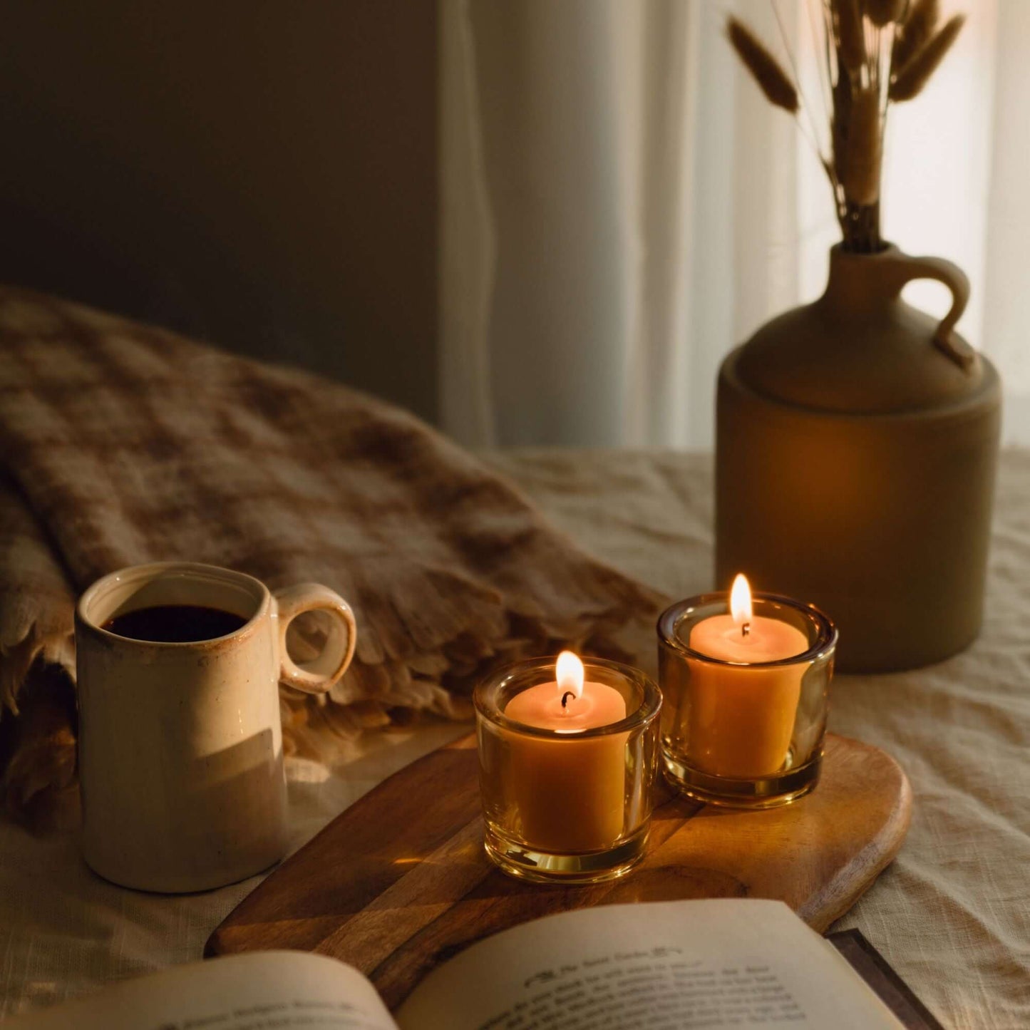 Bluecorn Candles heavy glass votive candle holders made from recycled glass, perfect for fall decor and cozy candlelight.