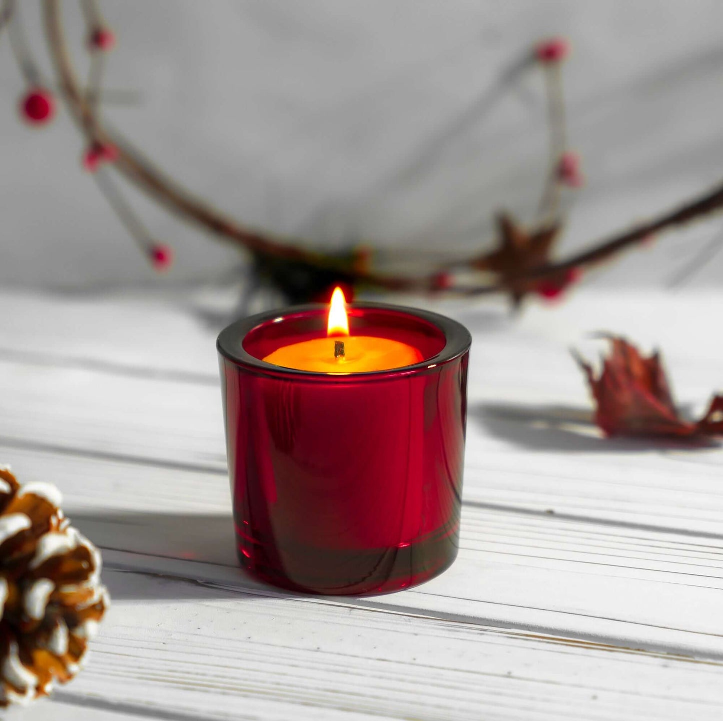 Bluecorn Beeswax Votive Candles in red holders, perfect for Christmas holiday decor and festive candlelight ambiance.