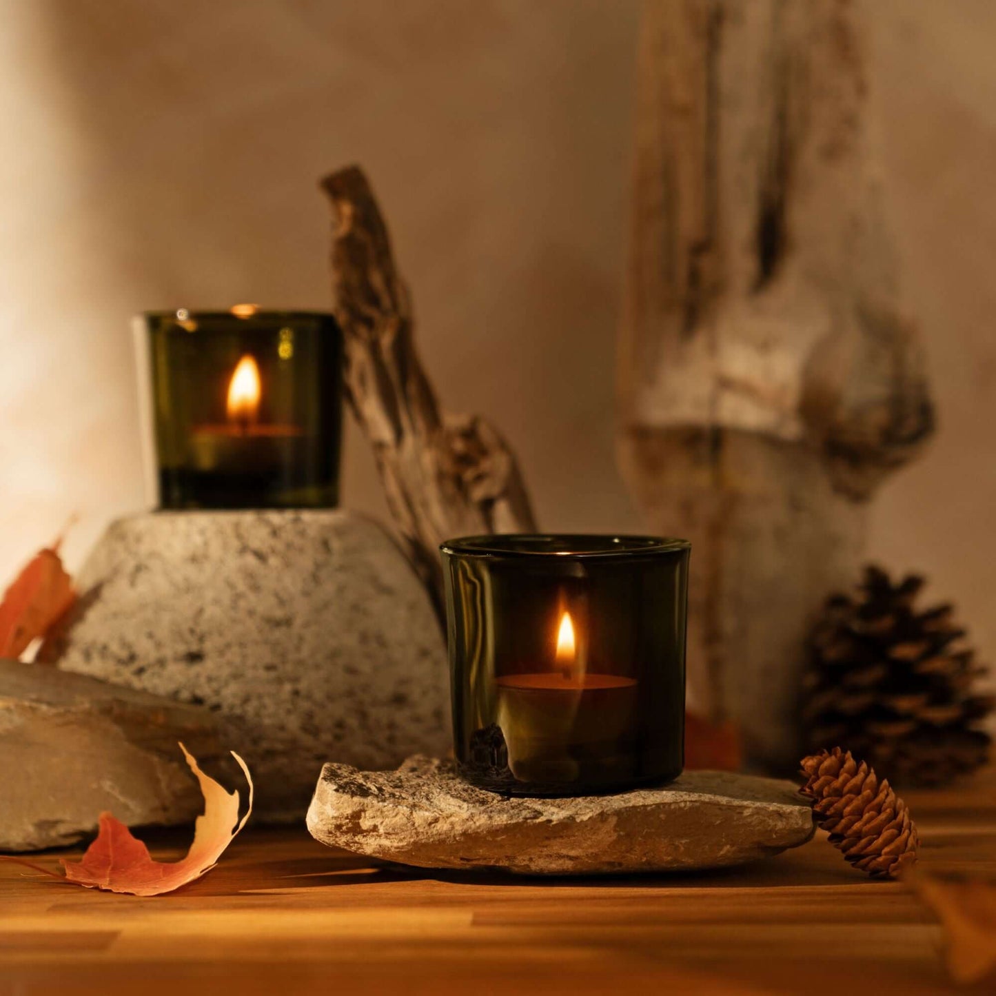 Pure beeswax tea light candles in heavy glass votive holders by Bluecorn Candles, ideal for warm candlelit ambiance.