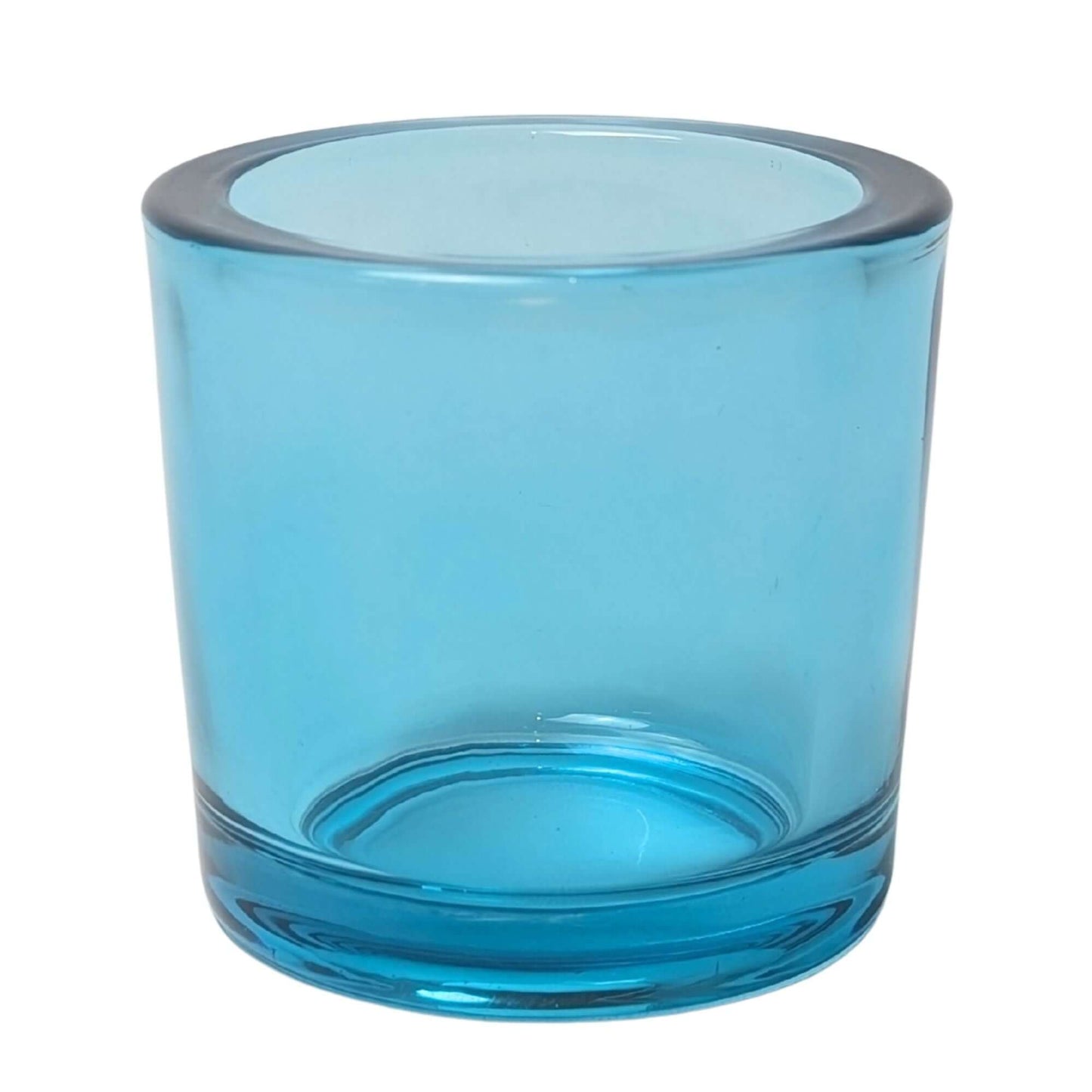 Light blue recycled glass votive candle holder from Bluecorn Candles, with a smooth, rounded design perfect for ambient lighting.