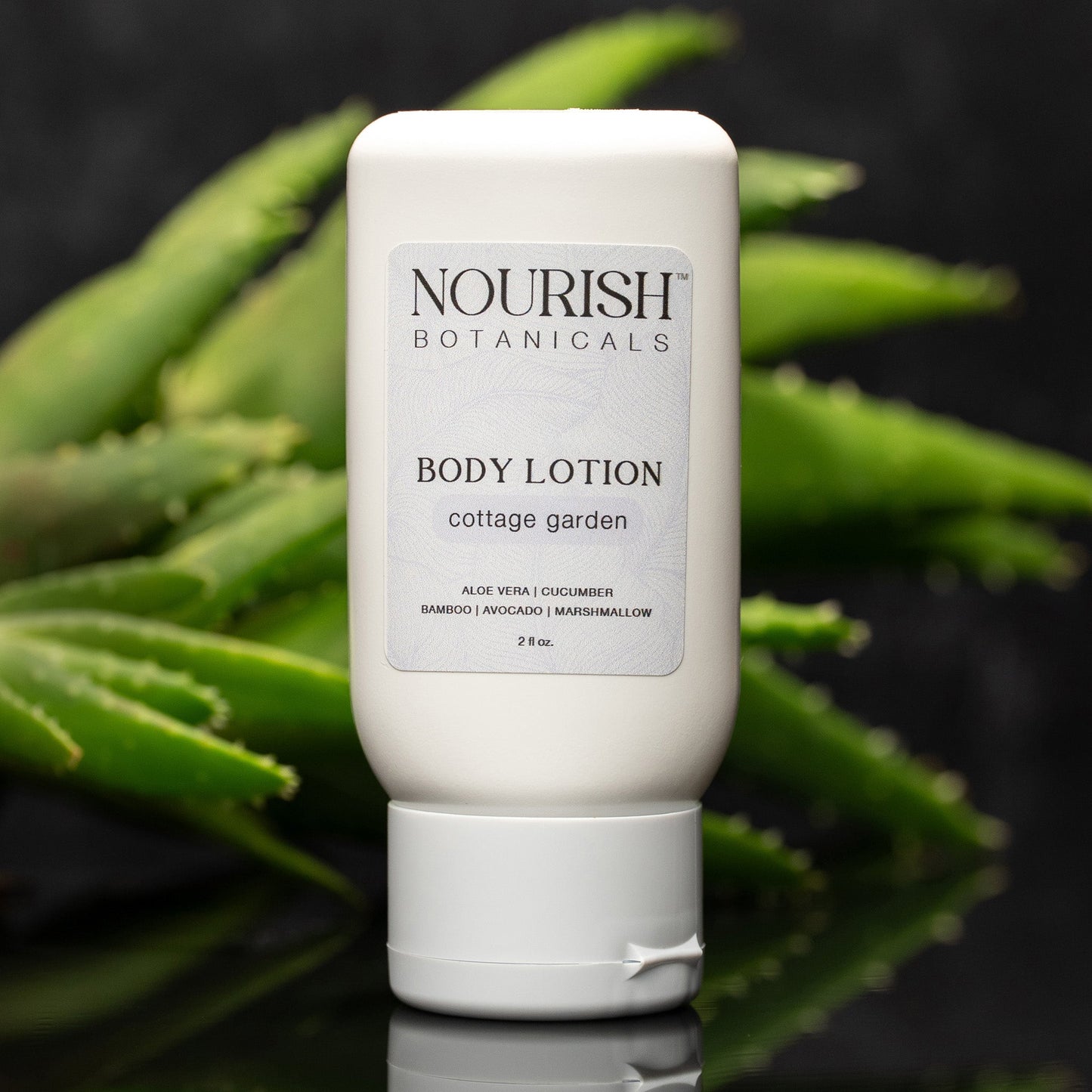 Rustic Strength Aloe Vera Body Lotion from Cottage Garden in a 2 oz bottle, featuring a soothing, natural skincare formula.