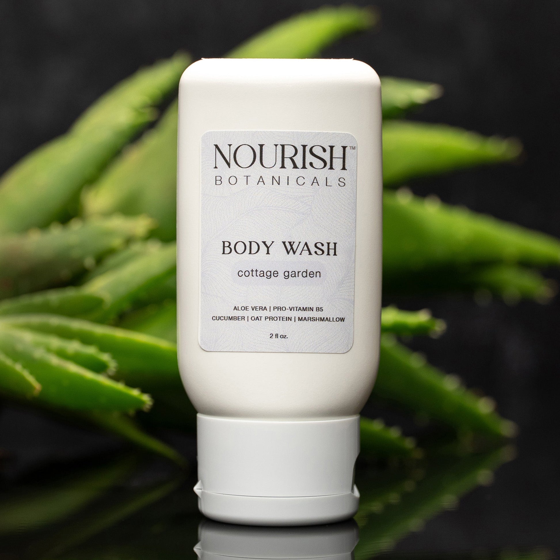 Rustic Strength Aloe Vera Body Wash from Cottage Garden, 2 oz bottle with clear liquid and label featuring green aloe vera leaves.