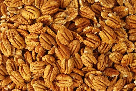 Raw Millican Pecan halves from Orchard Fresh, shelled and ready for baking or snacking in a natural, fresh appearance.