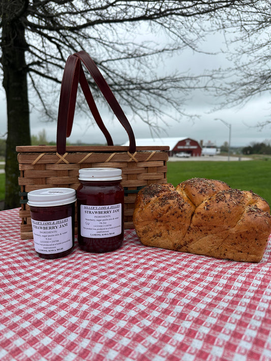 Amish Country Store Miller's Strawberry Jam jar with fresh strawberries and label, showcasing authentic Amish-made Amish jam.