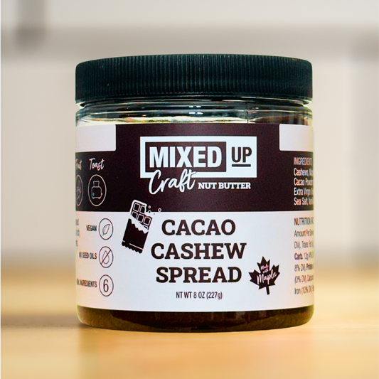 Creamy cacao and cashew nut butter in an 8 oz jar from Mixed Up Foods, ideal for spreading or snacking.