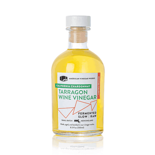 Front view of American Vinegar Works California Chardonnay Tarragon Wine Vinegar bottle with label and clear glass container.