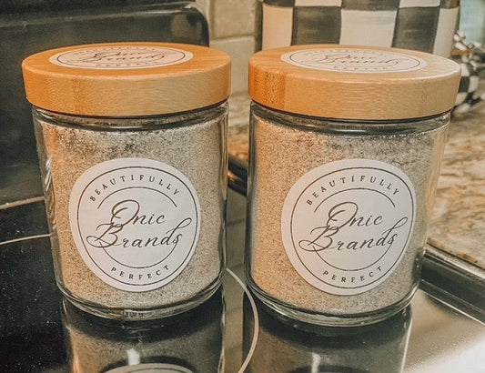 Onic Brands LLC cappuccino mix packet with a steaming cup of prepared cappuccino and coffee beans in the background.