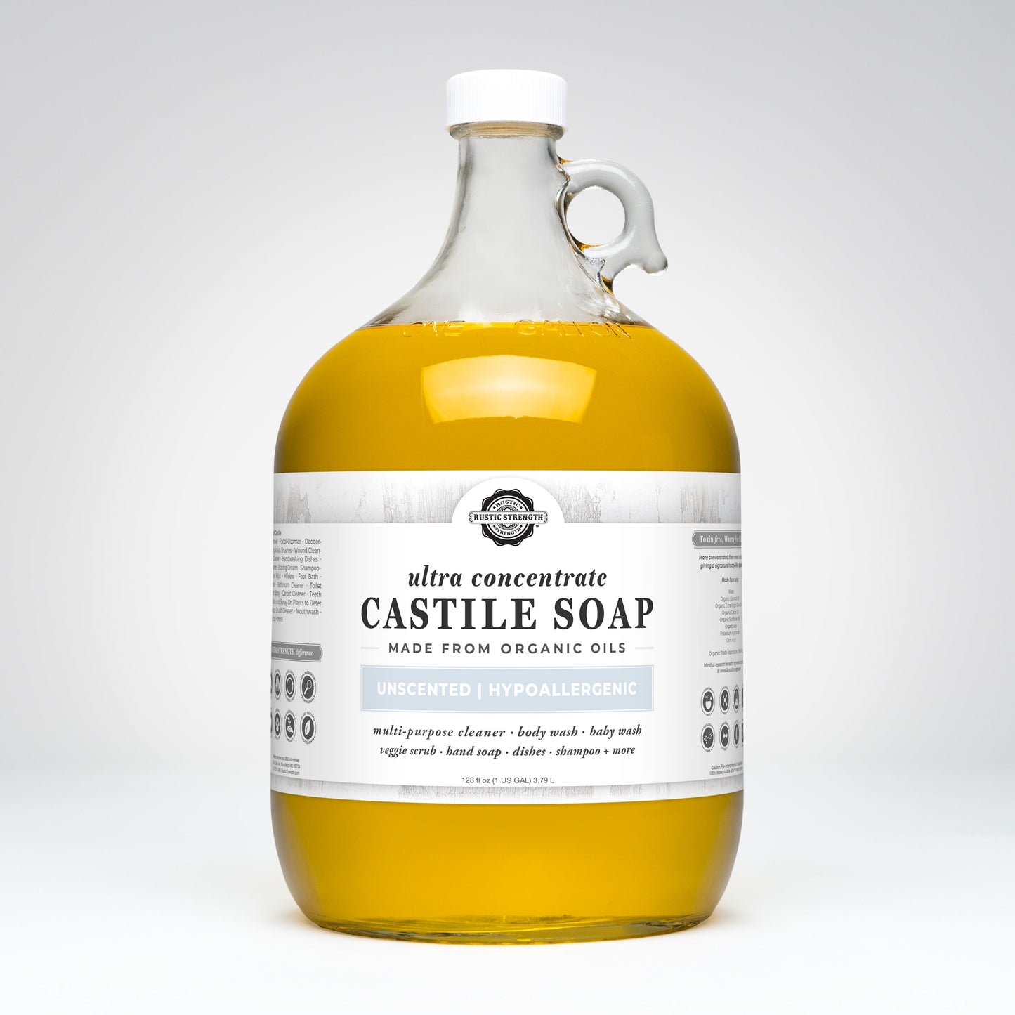 A large, clear glass jug with a white cap and handle contains Rustic Strength Castile Soap - Ultra Concentrate | Unscented, made from organic oils. This hypoallergenic soap is perfect as a multi-purpose cleaner.