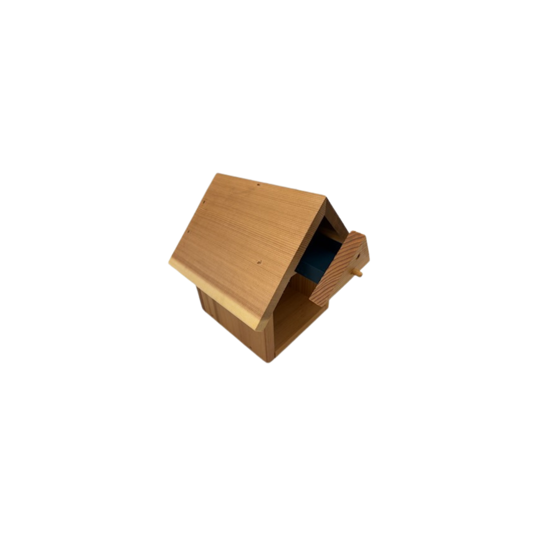 Cedar bee house with hatchery from CrownBees designed for native bees, featuring multiple nesting compartments and a roof.