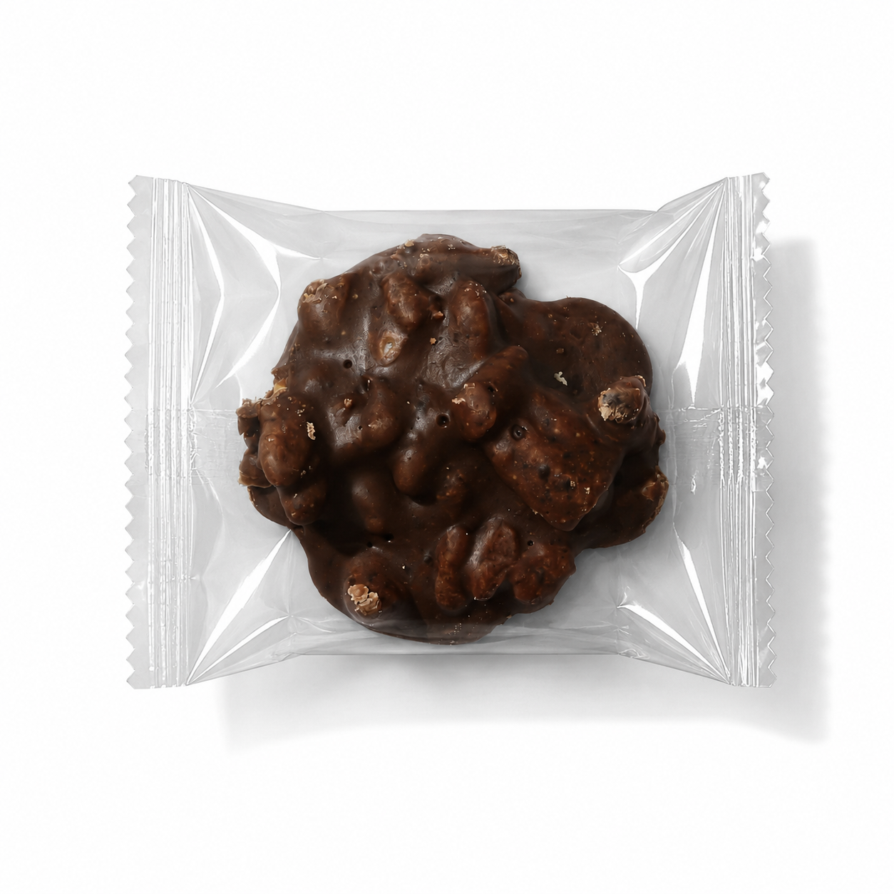 Six Mississippi Mudslide pralines from Louisiana Candy Company, creamy chocolate and pecan confections on a plate.
