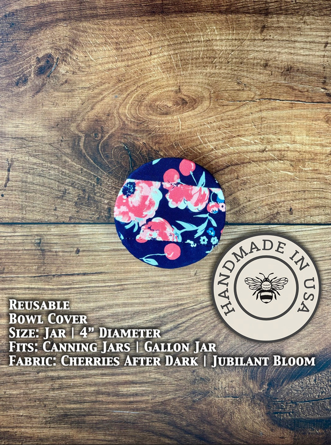 Dark red cherries from Five Oaks Farm jar covered with a decorative Farm-style lid in this image.