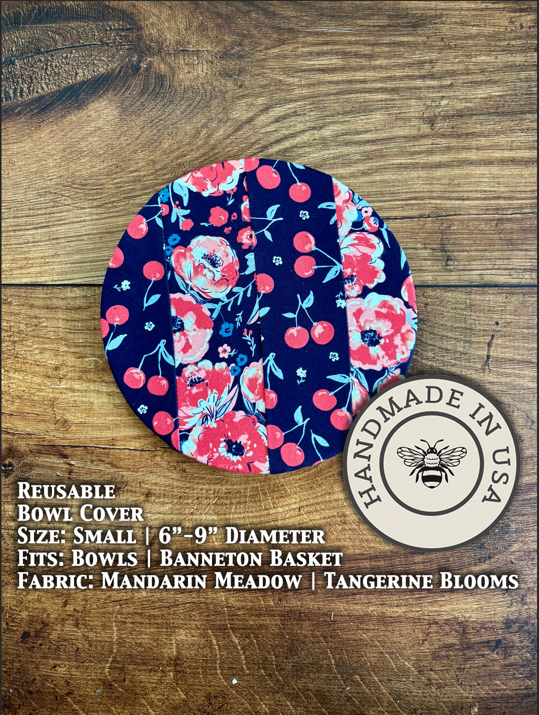 Small bowl and banneton covers from Five Oaks Farm with cherries and dark Jubilee bloom in the background.