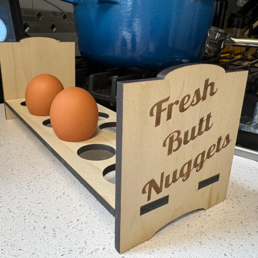 Countertop chicken egg holder for fresh eggs, featuring a playful design inspired by chicken butt nuggets by Quailz.com.