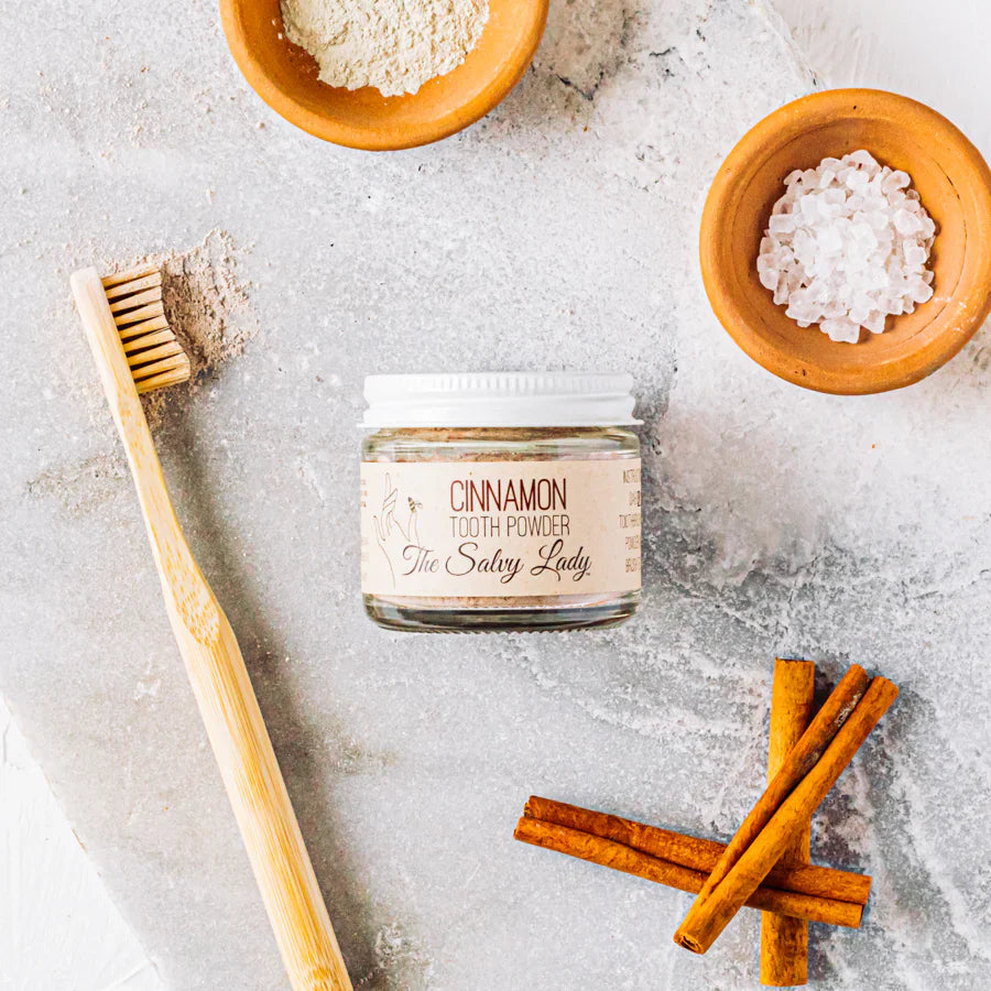Cinnamon-flavored fluoride-free tooth powder by The Salvy Lady in a 2 oz jar, natural oral care product for fresh breath.