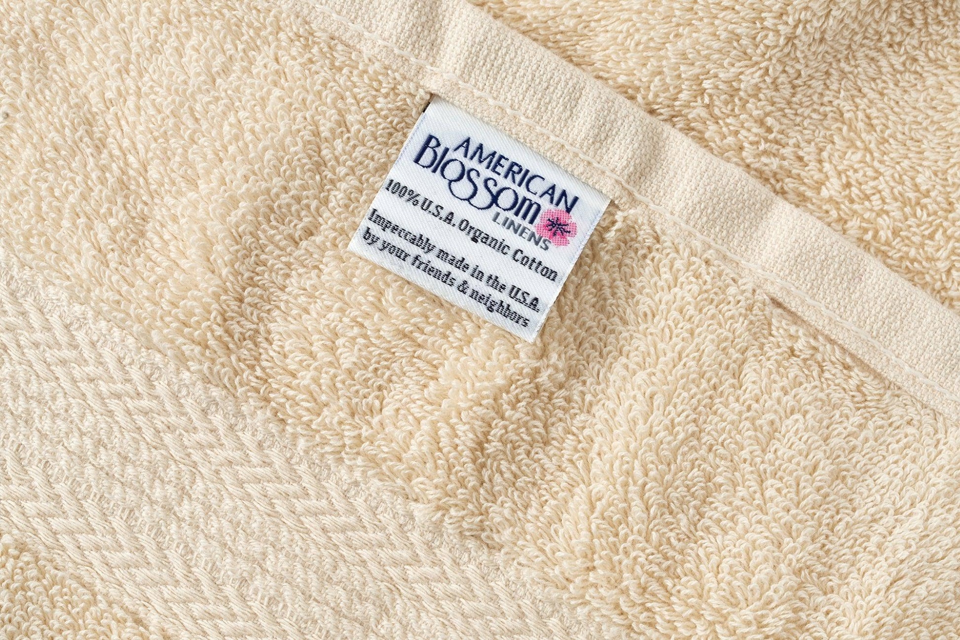 Closeup of American Blossom Linens luxury USA cotton bathroom washcloths with natural color and soft texture.