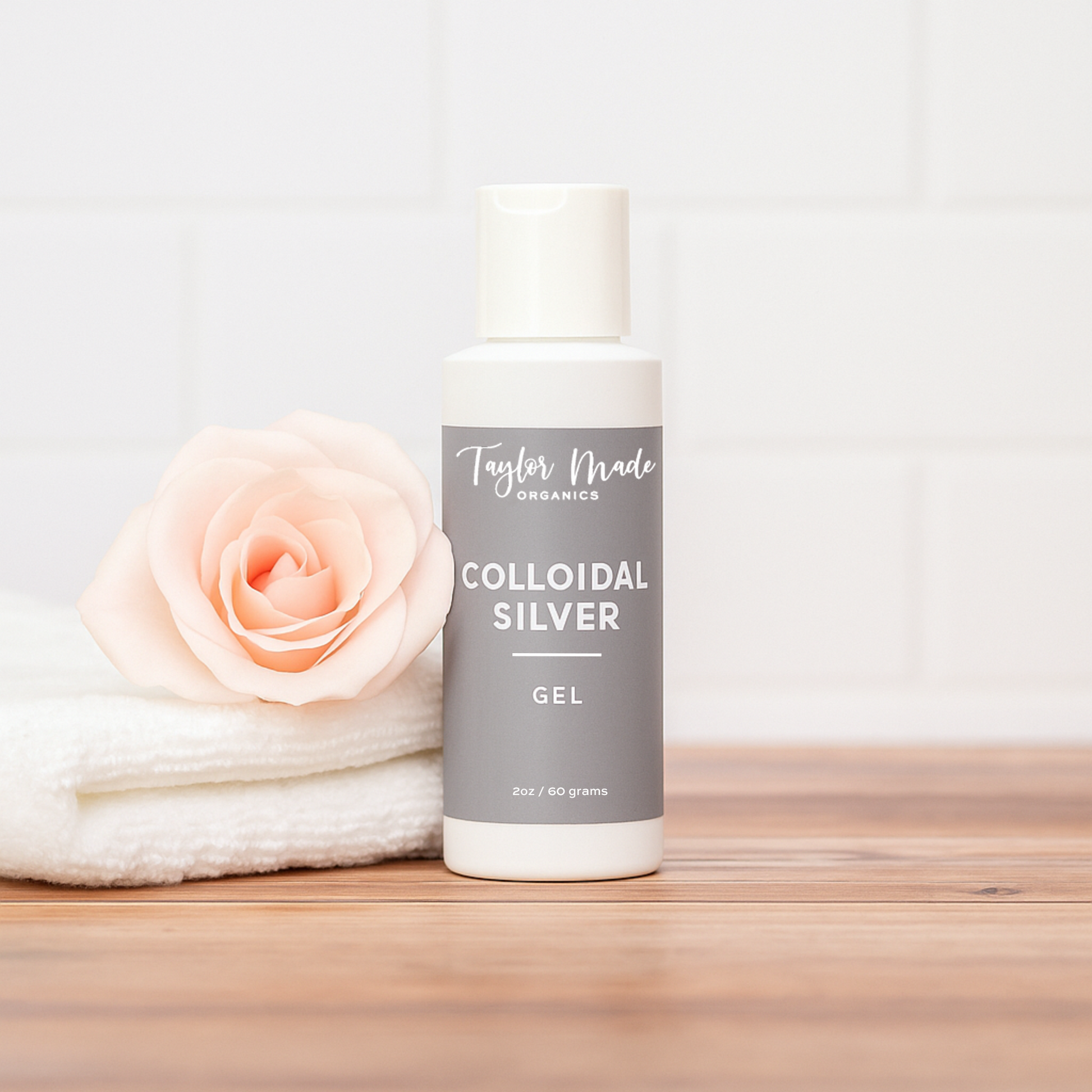 Organic colloidal silver gel in a therapeutic cream container by Taylor Made Organics, with a clear label and smooth texture visible.