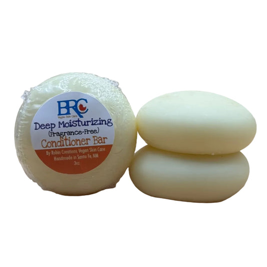 Deeply moisturizing natural hair conditioner bar by By Robin Creations, showing a sleek, eco-friendly conditioning bar on a neutral background.