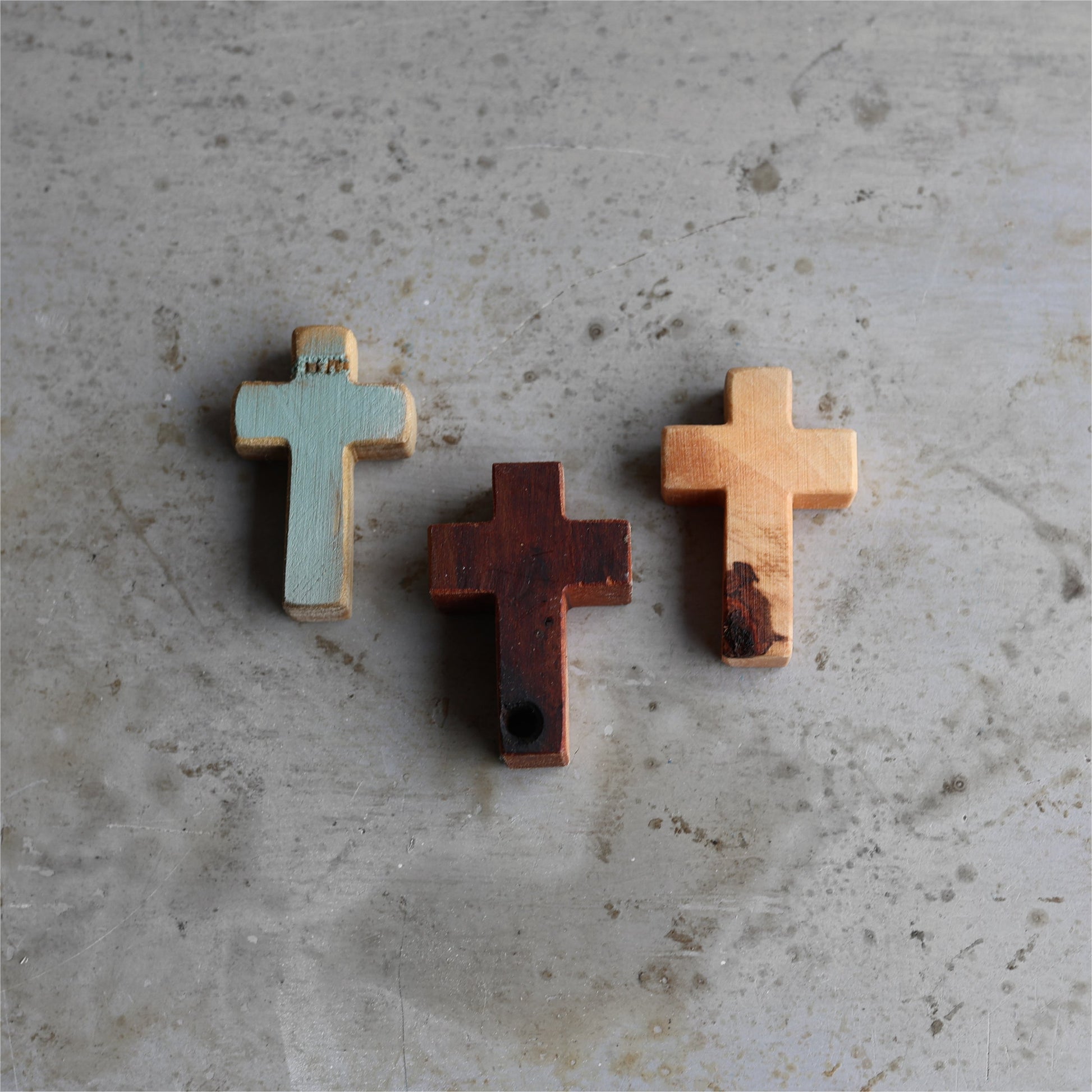 Wooden cross necklace from Dennehey Design Co., featuring a rugged pocket-style design with detailed craftsmanship.