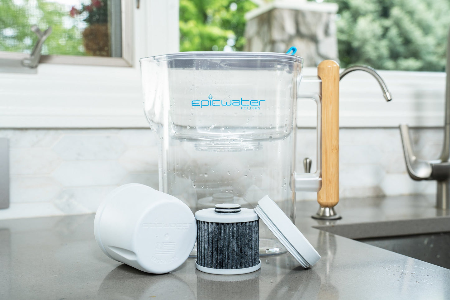 Red Epic Water Filters Pure XP pitcher with red lid, designed to reduce fluoride, PFAS, and parasites from drinking water.